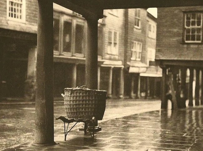 E.O. Hoppe (British, 1878-1972) Print: E.O. Hoppe (British, 1878-1972) Print. Butter Walk. Totnes. Devon. Printed in 1926. 8.00 x 6.00 inches. Not hand-signed unless otherwise stated. Photomechanical Print. Lots that contain nudity have