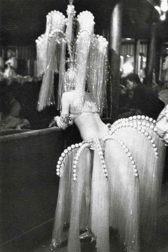 Edouard Boubat (French, 1923-1999) Print: Edouard Boubat (French, 1923-1999) Print. Folies-Bergere Paris, "1962". Printed in 1980. 5.00 x 7.50 inches. Not hand-signed unless otherwise stated. Photomechanical Print. Lots that contain nudity ha