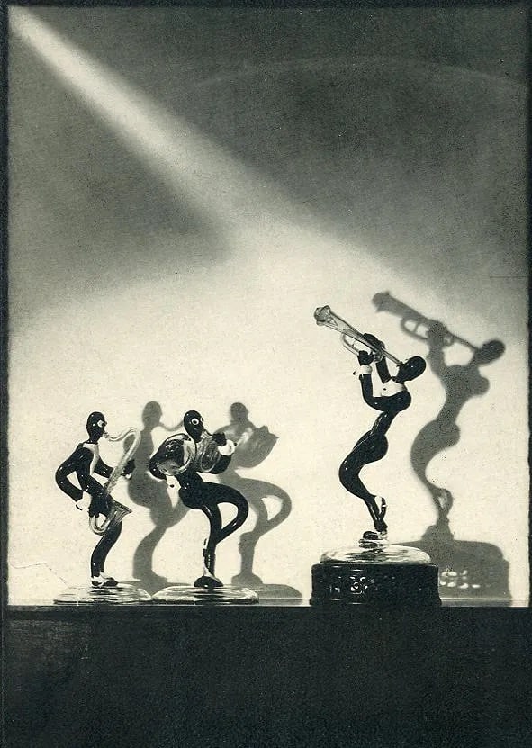 A De Lardi (American, 1900-1993) Print: A De Lardi (American, 1900-1993) Print. Syncopators. Printed in 1932. 5.00 x 8.00 inches. Not hand-signed unless otherwise stated. Photomechanical Print. Lots that contain nudity have been partially