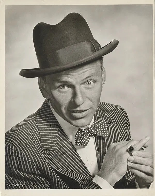Frank Sinatra (American, 1915-1998) Silver Gelatin: Frank Sinatra (American, 1915-1998) Silver Gelatin. Guys and Dolls, Nathan Detroit, "1955". 8.00 x 10.00 inches. Photomechanical Print. Lots that contain nudity have been partially obscured in the