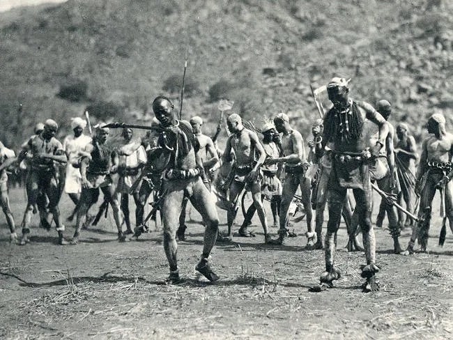 H.A Bernatzik (Austrian, 1897- 1953) Print: H.A Bernatzik (Austrian, 1897- 1953) Print. Nuba Rattle Dance, Africa. Printed in 1931. 6.00 x 8.00 inches. Not hand-signed unless otherwise stated. Photomechanical Print. Lots that contain nudity