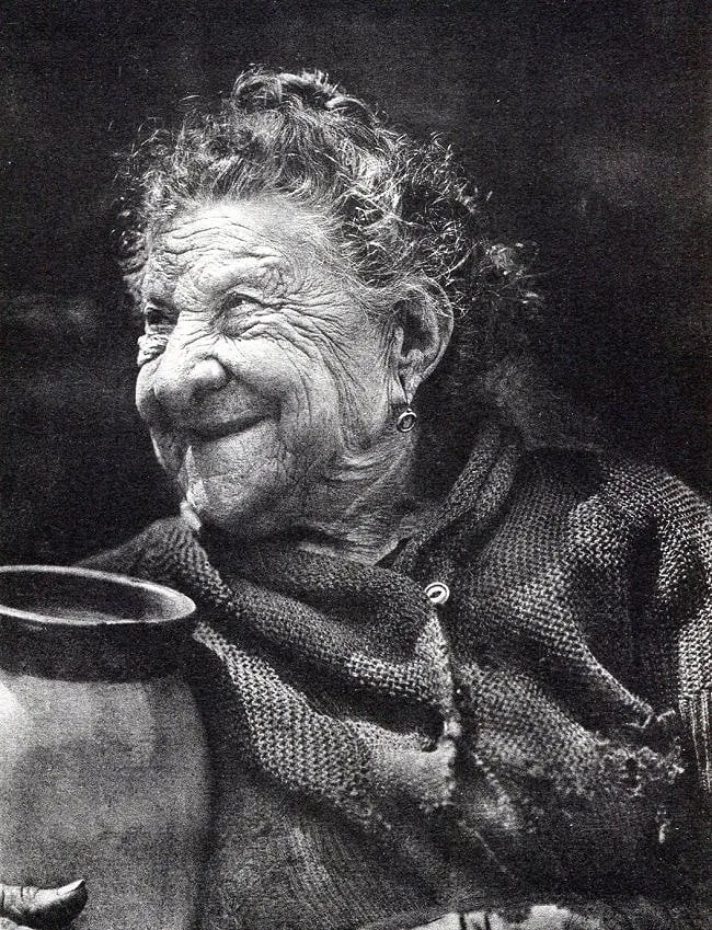 Leon De Vos Print: Leon De Vos Print. Nonna Marianna. Printed in 1929. 7.00 x 8.50 inches. Not hand-signed unless otherwise stated. Photomechanical Print. Lots that contain nudity have been partially obscured in the