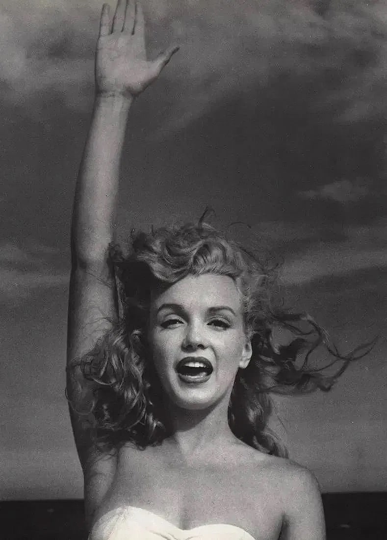 Andre de Dienes (Hungarian, 1913-1985): Andre de Dienes (Hungarian, 1913-1985). Marilyn Monroe, Reaching Print. 11.50 x 9.50 inches. Printed in the 1980s. Photomechanical Print. Lots that contain nudity have been partially obscured in the