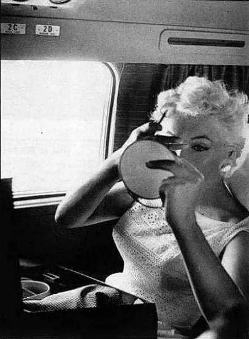 Eve Arnold (American, 1912-2012) Print: Eve Arnold (American, 1912-2012) Print. Marilyn Monroe, Makeup, "1955". Printed in 1987, USA. 6.00 x 9.00 inches. Photomechanical Print. Lots that contain nudity have been partially obscured in the li
