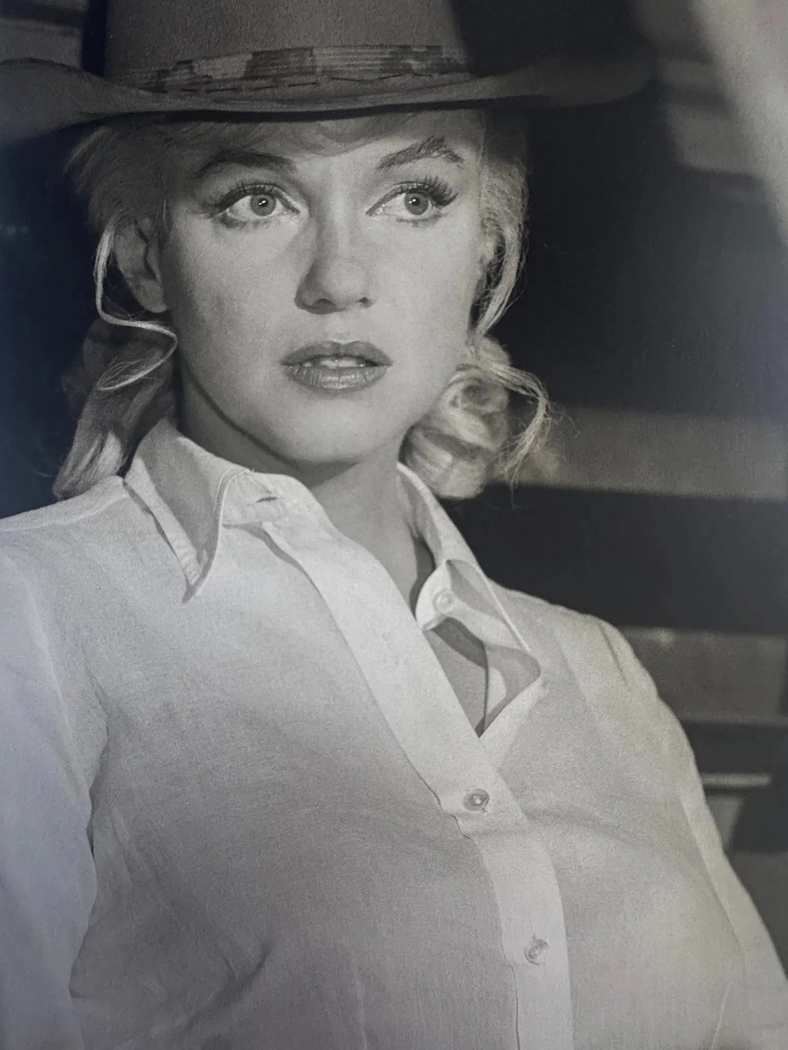 Eve Arnold (American, 1912-2012) Print: Eve Arnold (American, 1912-2012) Marilyn Monroe Print. Printed in Belgium. Marilyn Monroe on set of The Misfits, Nevada, "1960". 9.75 x 6.75 inches. Photomechanical Print. Lots that contain nudity