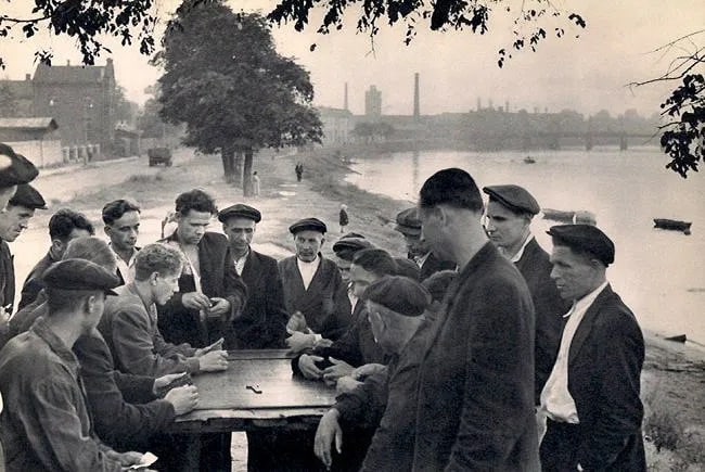 Henri Cartier-Bresson (French, 1908-2004) Print: Cartier-Bresson (French, 1908-2004) Print. Dominoes in the Suburbs of Leningrad. Printed in 1955. 9.00 x 6.00 inches. Not hand-signed unless otherwise stated. Photomechanical Print. Lots that contain