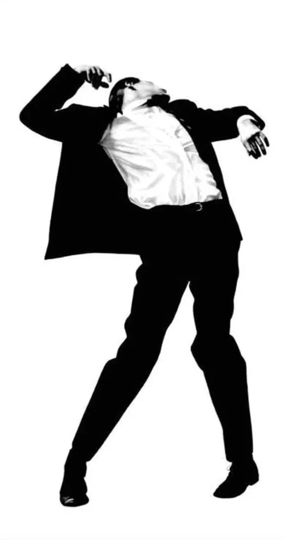 After Robert Longo (American, b. 1953) Man in Suit Print: After Robert Longo (American, b. 1953) Man in Suit. 44.00 x 79.00 inches. Photomechanical Print. Lots that contain nudity have been partially obscured in the listing; unblurred images are available