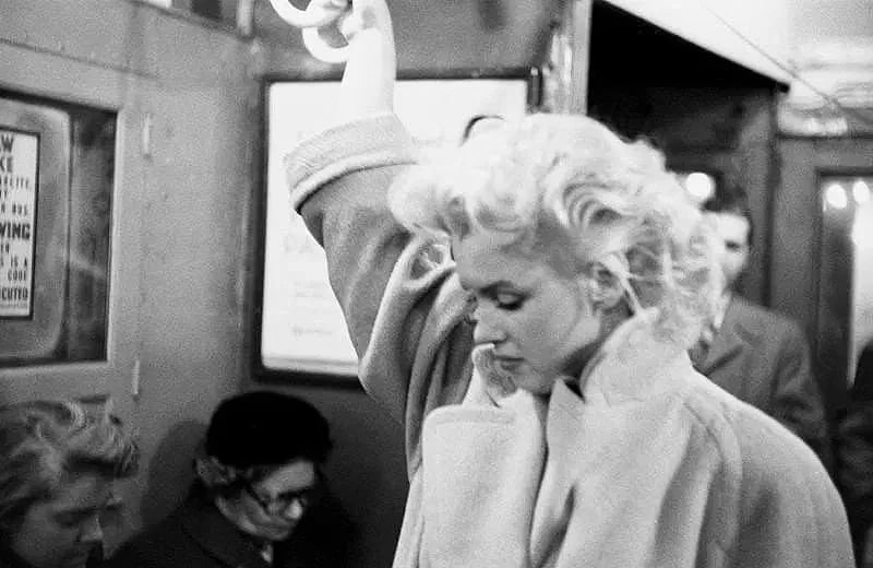 Ed Feingersh (American, 1925-1961) Print: Ed Feingersh (American, 1925-1961) Print. Marilyn Monroe, Grand Central Station, March 24, "1955", New York City. Photomechanical Print. Lots that contain nudity have been partially obscured in the