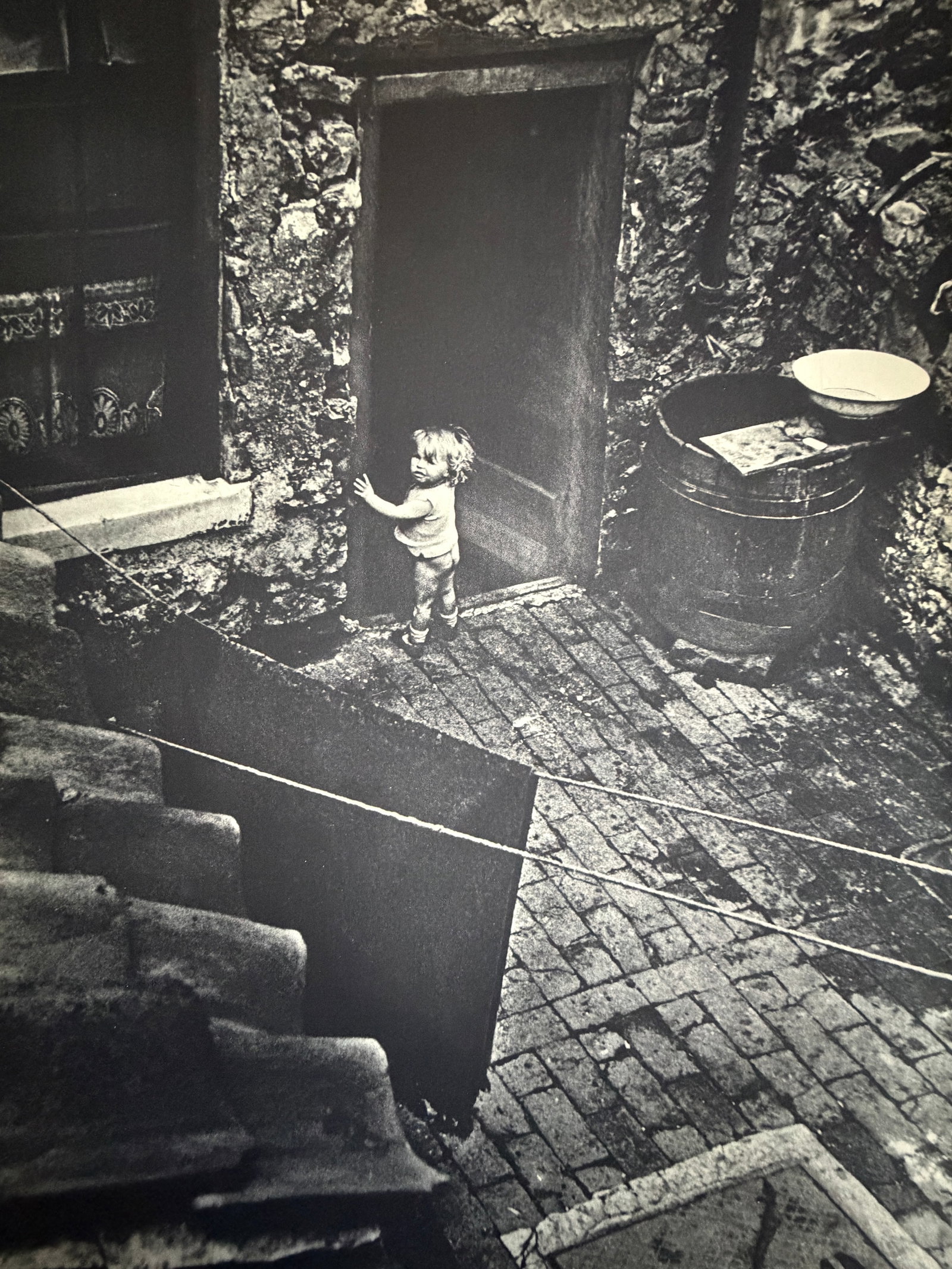Bill Brandt (British, 1904-1983) Print: Bill Brandt (British, 1904-1983) Print. Londres. L'Enfant Pawre. Printed in 1939, France. 12.00 x 9.00 inches. Not hand-signed unless otherwise stated. Photomechanical Print. Lots that contain nudity