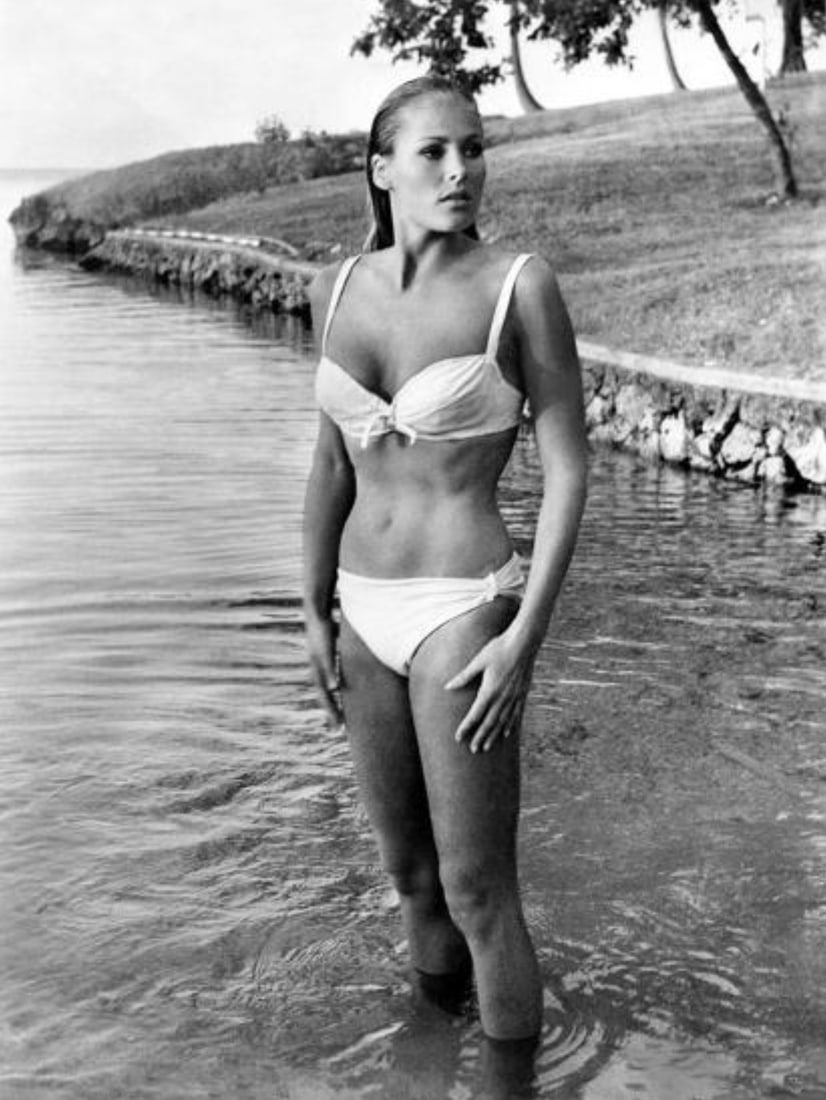 Ursula Andress (Swiss, b. 1936) Print: Ursula Andress (Swiss, b. 1936) Print. James Bond, Dr. No, "1962". 17.00 x 22.50 inches. Not hand-signed unless otherwise stated. Photomechanical Print. Lots that contain nudity have been partially