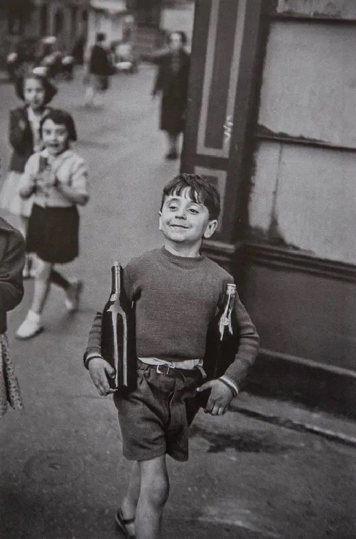 Henri Cartier Bresson (French, 1908-2004) Print: Henri Cartier Bresson (French, 1908-2004). Rue Mouffetard, Paris, "1954" Print. 6.80 x 10.25 inches. Printed in 1979. Not hand-signed unless otherwise stated. Photomechanical Print. Lots that contain
