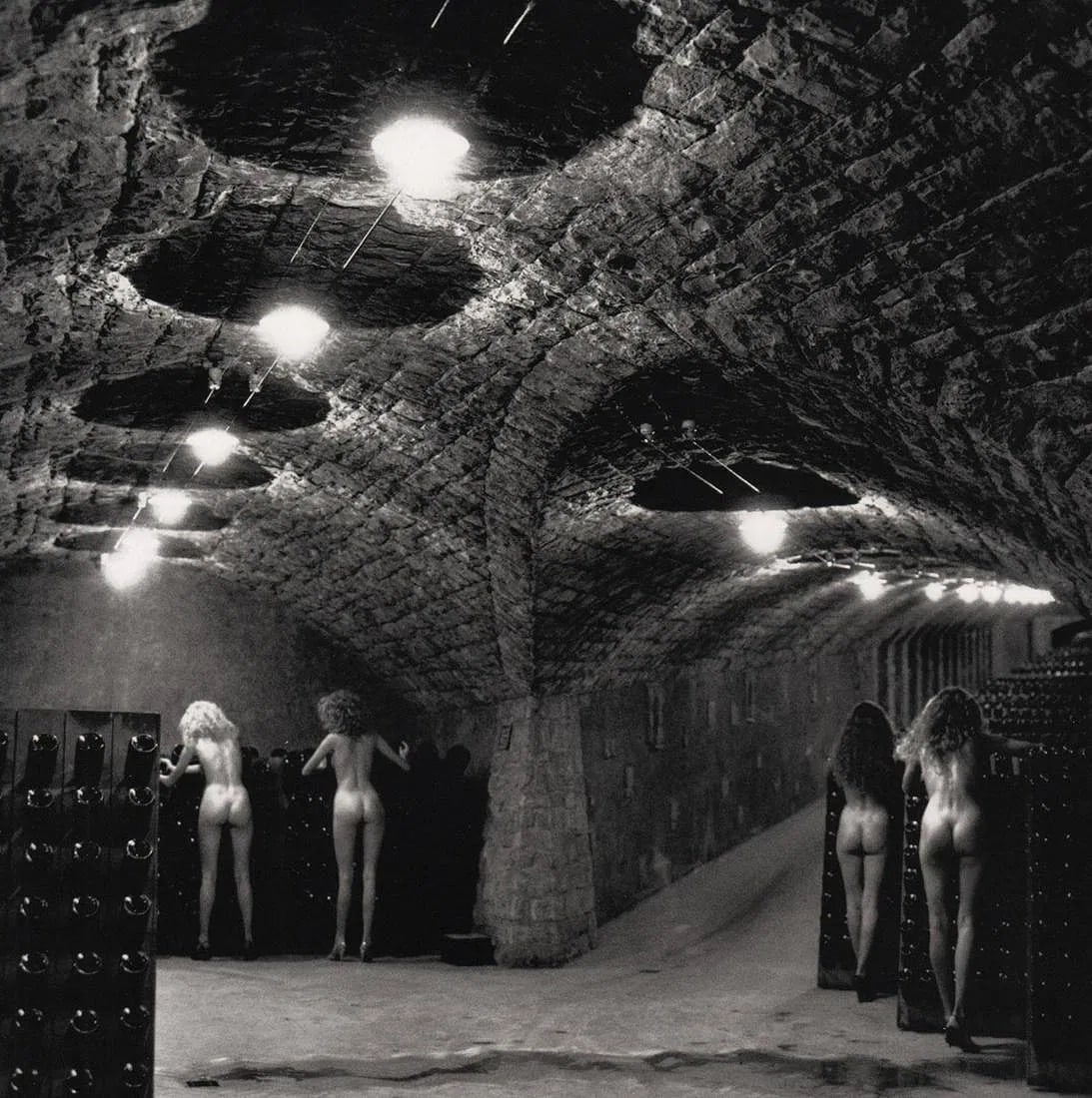 Helmut Newton (German-Australian, 1920-2004) Print: Helmut Newton (German-Australian, 1920-2004) Print. Nudes in the Cellars of Ca'del Bosco. Printed in 2000s, Italy. 8.00 x 8.00 inches. Not hand-signed unless otherwise stated. Photomechanical Print.