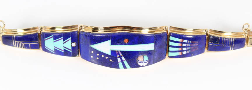 Julian Arviso 14k Gold Designer Bracelet: One doesn't need to see the signature to recognize the artist, Julian Arviso (1959-2011). Signed by the Navajo artist, this marked 14k gold bracelet is circa 1980s. Size is 7.75" in length with its wi