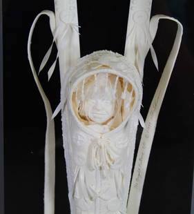 Sioux baby original Cast Paper Sculpture by Allen & Patty Eckman: This original fiber sculpture of a Sioux baby in beaded papoose (cradle board) is titled "The Bright Future". The sculpture is housed in its original vertical acrylic display box which can be wall mou