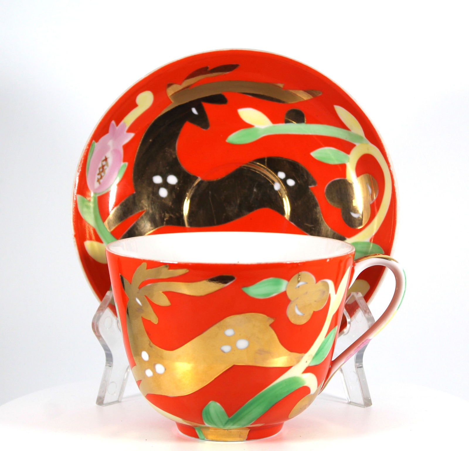 Golden Deer Tea Cup and Saucer Russian Dulevo: Vintage Russian Golden Deer tea cup and saucer by the Dulevo Porcelain Factory. The Golden Deer pattern is designed by Artist Leonov Petr and was awarded a gold medal at the 1958 World's Fair in Bruss