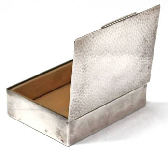 Austrian Cigarette Box Early 20th Century possibly Silver Alloy: Early 20th Century, Art Deco, wood-lined hammered, white metal cigarette box. This sleek box is stamped L W and produced in Austria, possibly silver alloy. During the intermittent World Wars, Germany
