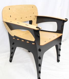 Early Puzzle Chair Designed by David Kawecki Produced by San Francisco Interiors: Early 1990s Puzzle Chair by award winning designer David Kawecki. Laser-cut birch plywood with non toxic acrylic stain and beeswax. Markers label reads: Puzzle design: Kawecki patent pending 3D: Inter