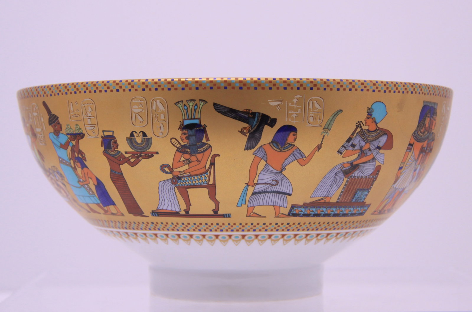 24K Gold Porcelain Bowl 'Homage to Tutankhamun' by Kaiser: Homage to Tutankhamun porcelain bowl with 24K Gold and Egyptian motif scenes from the days of Pharaoh Tutankhamun. This is circa 1980s limited edition 229 of 5000 of the Ghent Collection by Kaiser Por