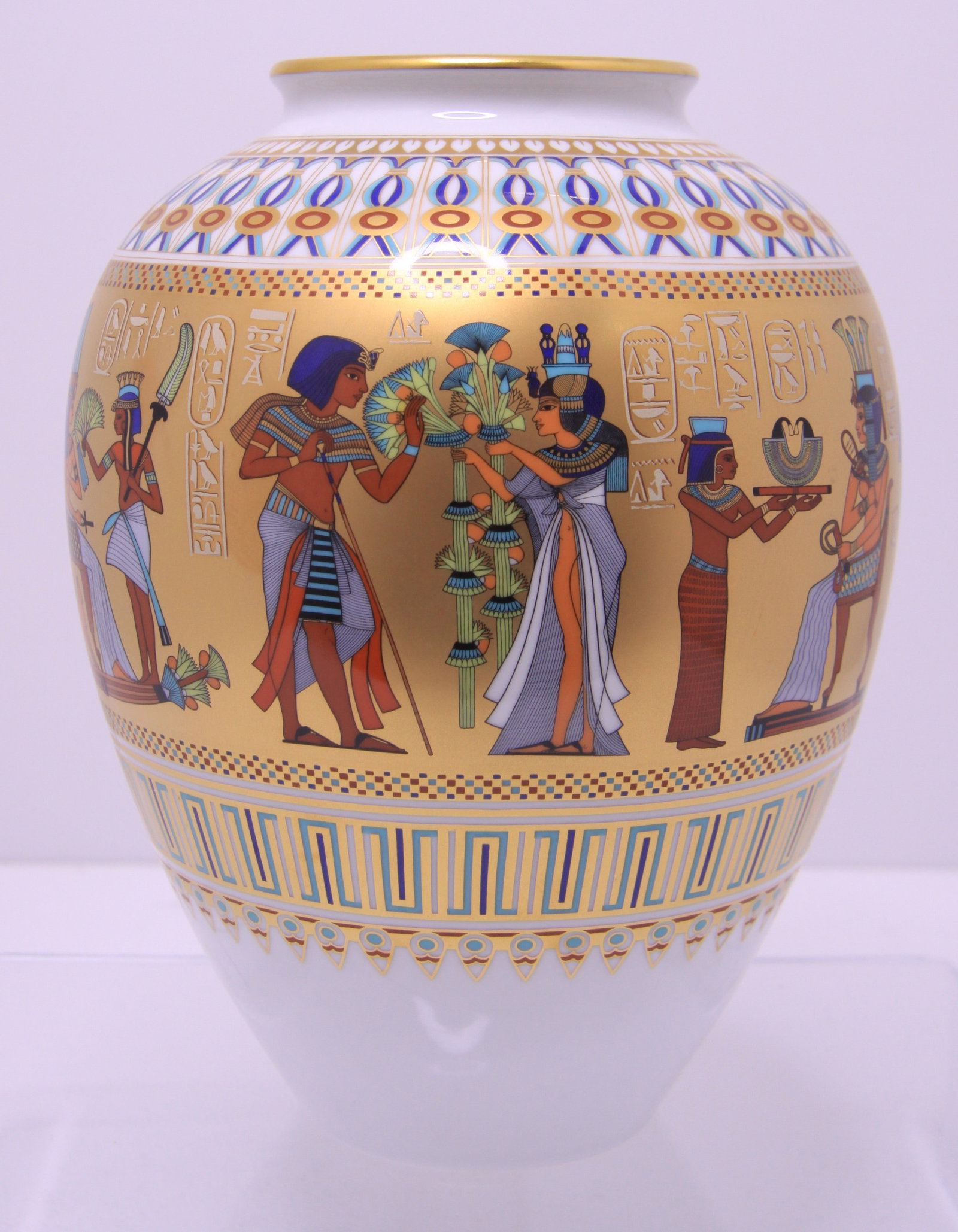 24K Gold Porcelain Vase 'Scenes from the Tomb of Tutankhamun by Kaiser: Scenes from the Tomb of Tutankhamun porcelain vase is number 826 of 2500, circa 1980s. Beautiful 24K Gold and Egyptian motif scenes from the days of Pharaoh Tutankhamun, this vintage limited edition o