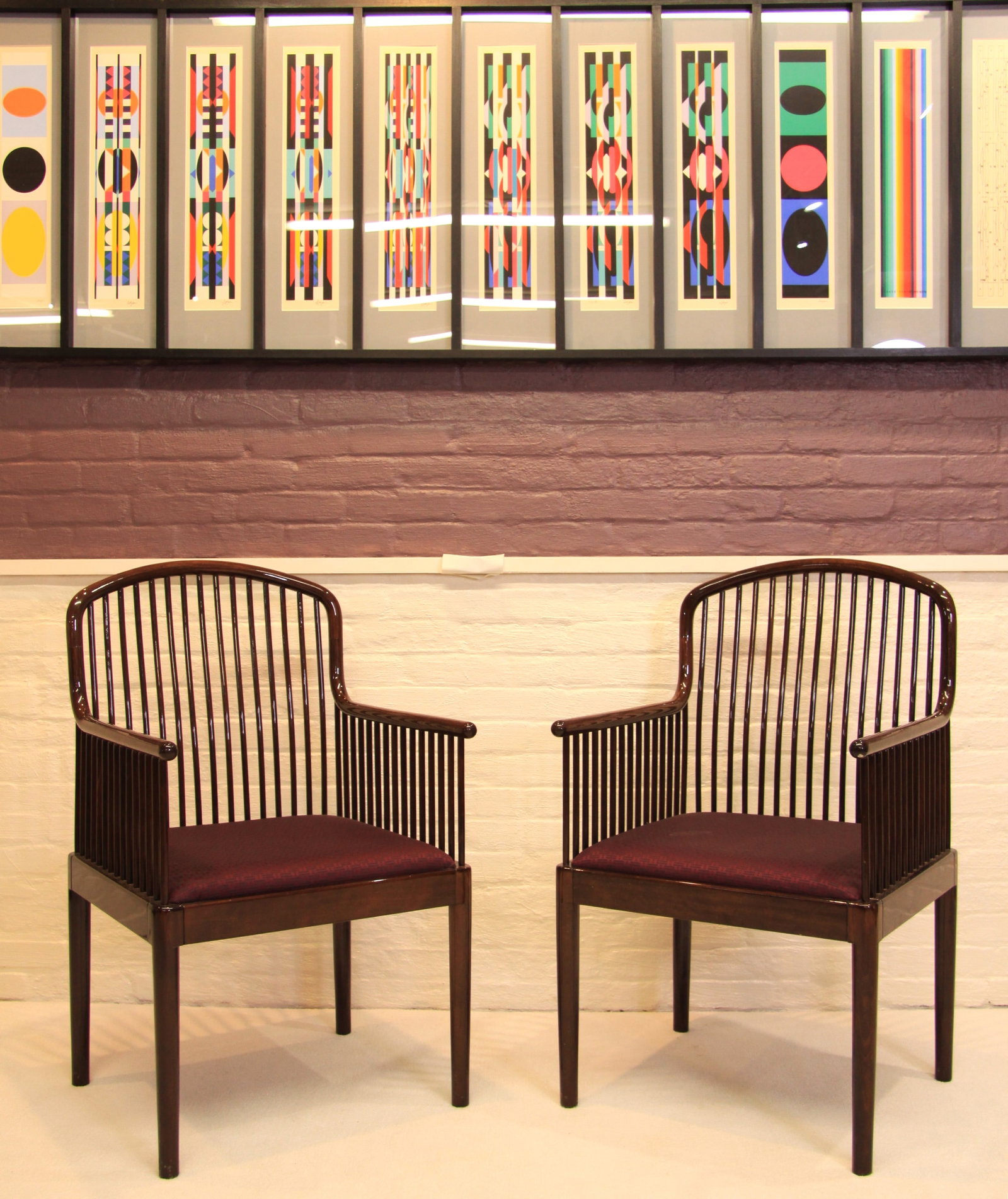 Pair Davis Allen Andover Chairs for Stendig: A pair of circa 1980s andover armchairs designed by Davis Allen for Stendig. Beautiful spindle back rosewood chairs with eggplant silk upholstered seats in excellent condition. Each measures 37" x 22"