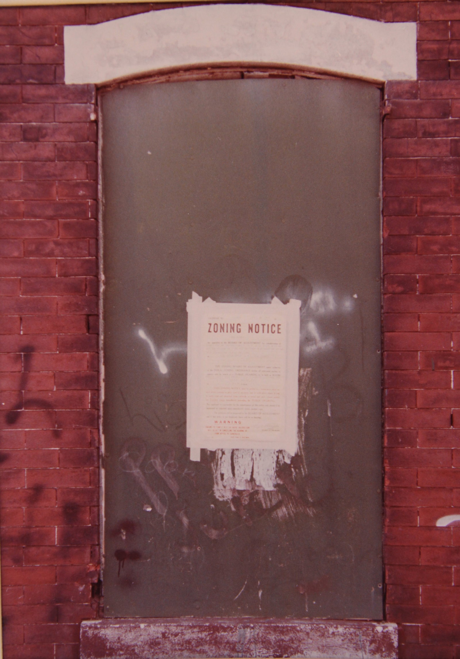 Original Photograph Zoning Notice Vincent Feldman likely Philadelphia Vintage: This orginial photograph of a boarded shut window with 'Zoning Notice' taped upon it is likely a Phildelphia building, pre 1990s. It is signed at the bottom right on the matting. Given this estate was