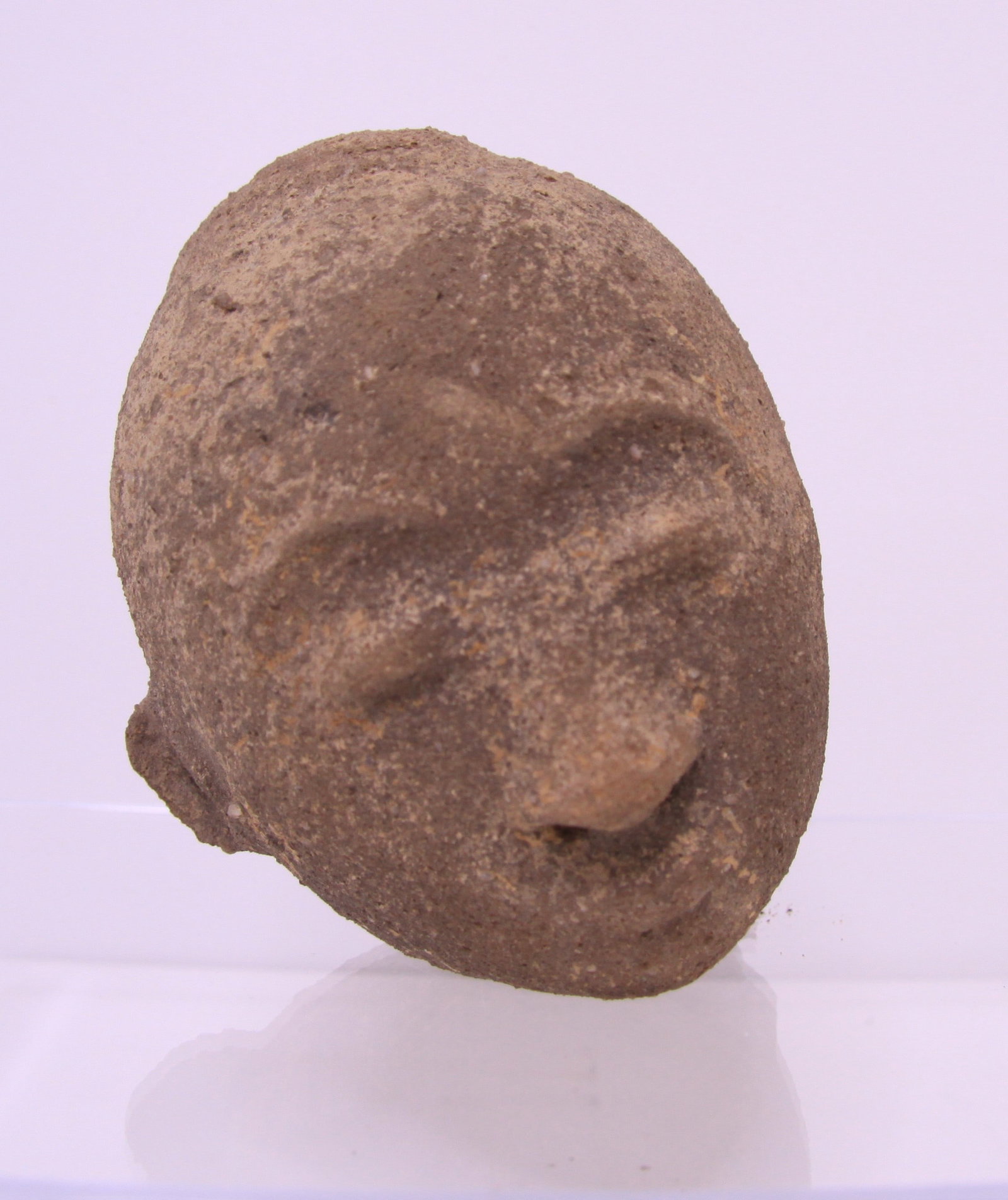 Akan African Commemorative Head 18th Century Ghana: Possibly 17th or 18th Century terracotta head in the style of Twifo-Hemang people of South Central Ghana. Funeral sculptures represented the deceased ancestor. The design is consistent with the Twifo-