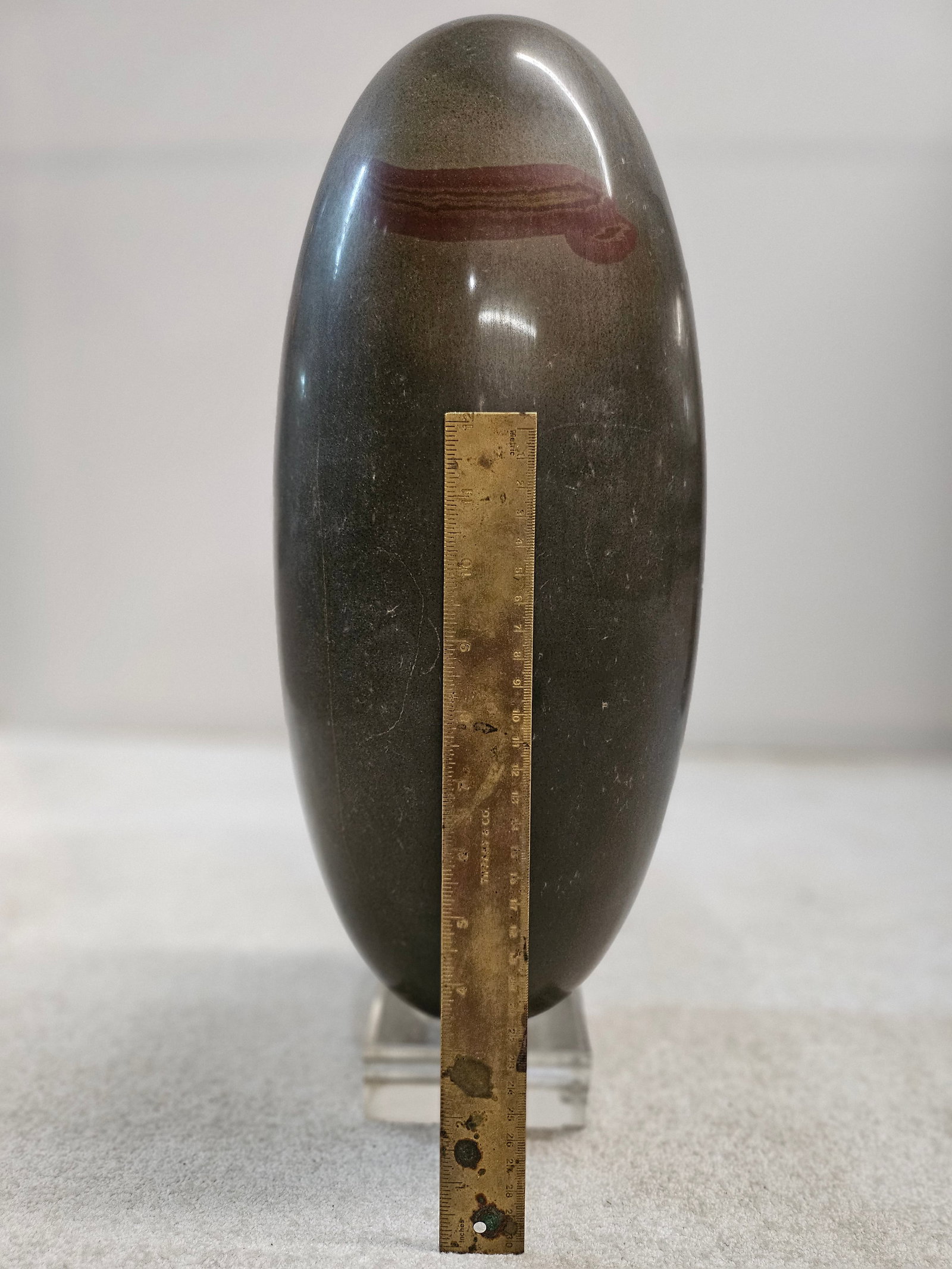 Shiva Lingam Stone rare XL size of 17 inches from Narmada River: A scarce size extra-large 16 3/4 inches tall Shiva Lingam stone in its perfectly balanced egg-shaped form. Hindu lingam stones are sourced from the sacred Narmada River in Onkar Mandhata, Western Indi