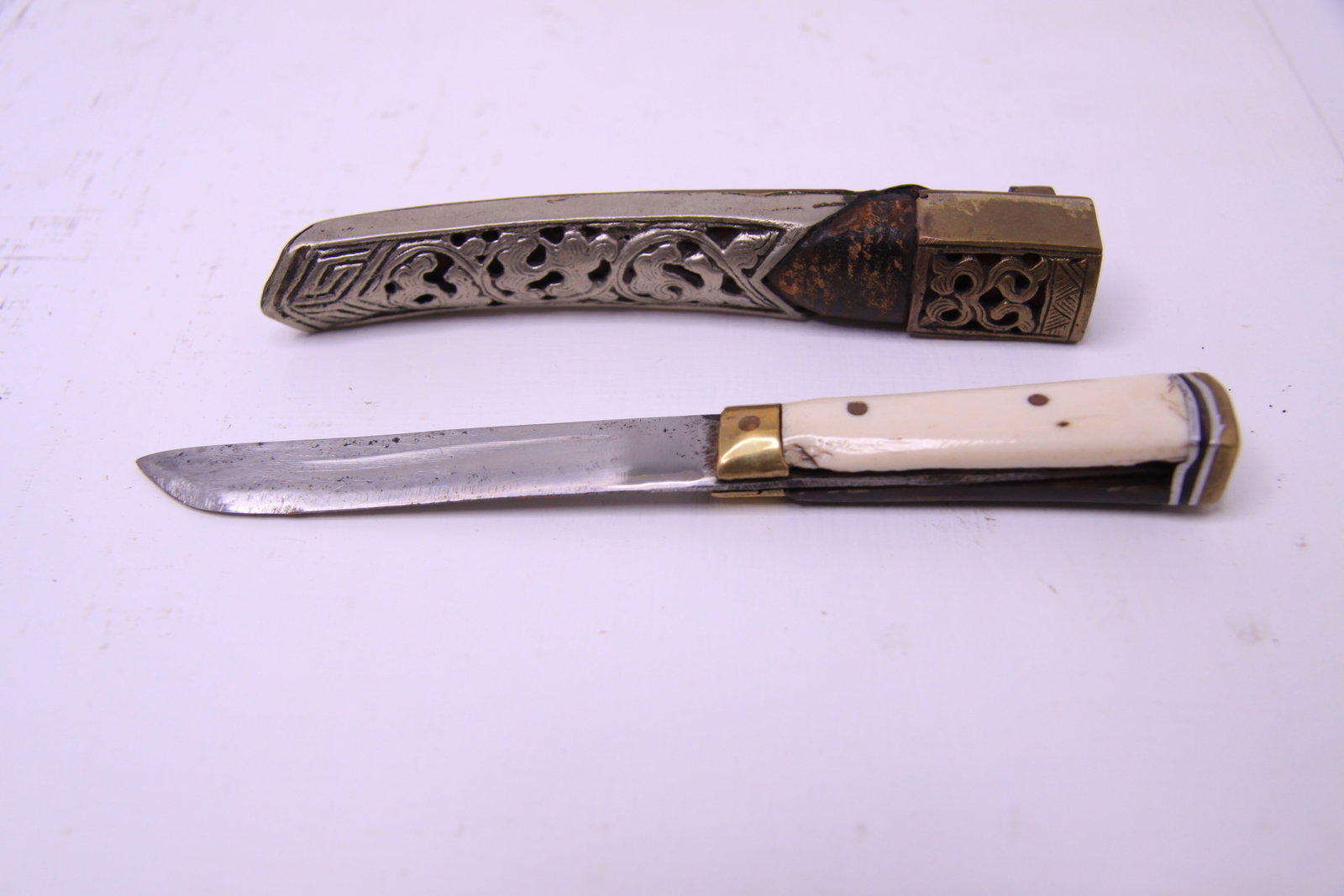 Antique Central Asian Uzbek Pchak Knife with Bone & Horn Handle Pierced Scabbard: Antique Central Asian pchak (pichoq/bichaq) type knife, attributed to Uzbekistan or the greater Bukharan region, likely late 19th to early 20th century. The knife features a straight single-edged stee