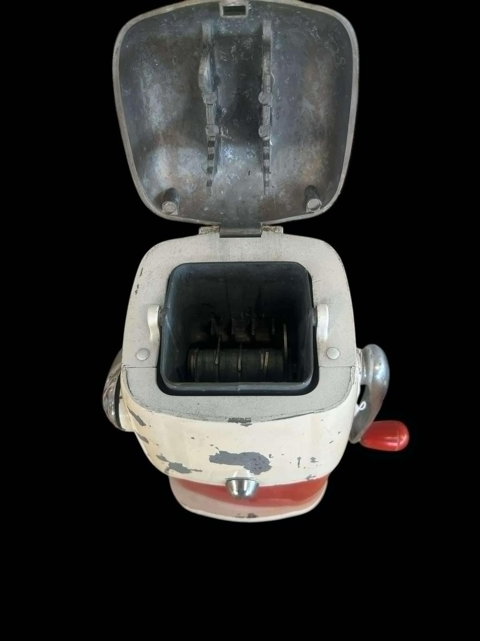 ICE-O-Mat Mid 20th Centaury hand crank ice Crusher: The ICE-O-Mat Mid-20th Century Hand Crank Ice Crusher is a vintage kitchen appliance that became popular during the mid-20th century for its ability to crush ice by hand. ICE-O-Mat was a prominent bra