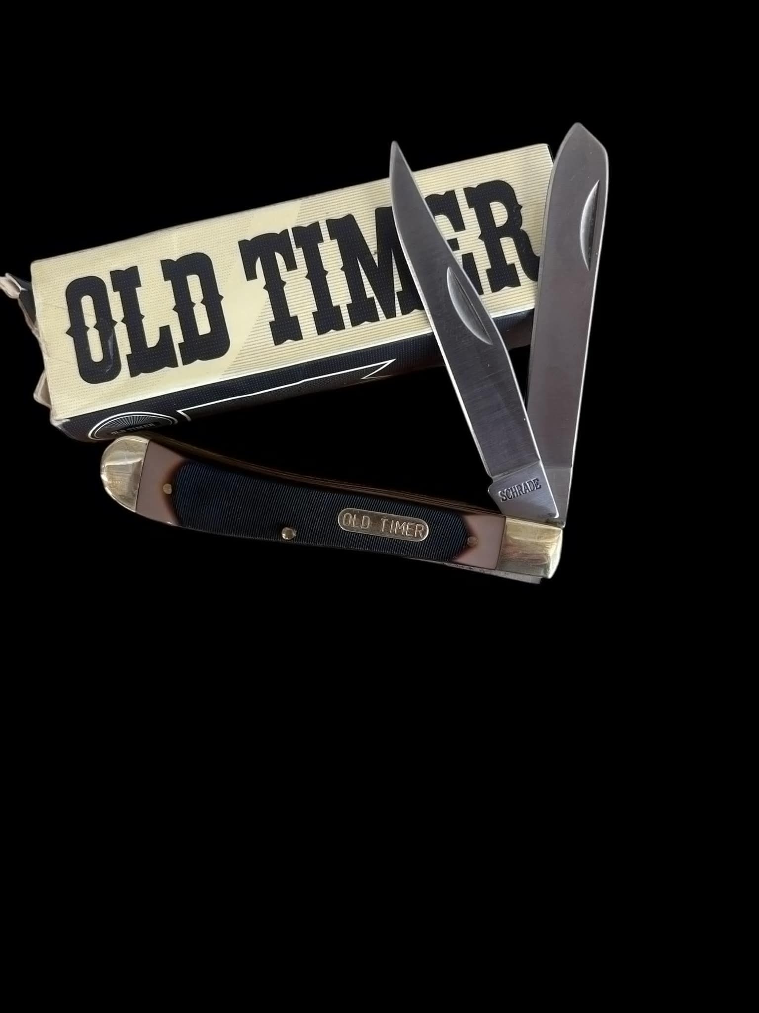 Old Timer Gunstock Trapper: The Old Timer Gunstock Trapper is a traditional folding pocket knife known for its classic design and reliability. It typically features two blades—a Clip Point and a Spey blade—crafted from high-