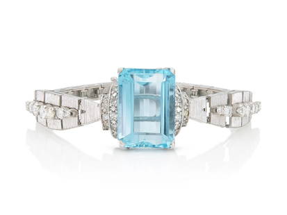 Vintage 30ct Aquamarine Diamond Bracelet 18k Retro: Finely crafted in 18k white gold with an Emerald cut Aquamarine weighing approximately 30.00 carats as well as Round Brilliant and Single cut Diamonds weighing approximately a total of 2.60 carats. -