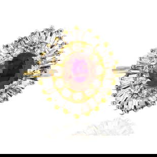 18k Ruby and Diamond Ring 4.48gthu: 18k Ruby and Diamond Ring featuring a fine Thai ruby and a burst of baguette and round brilliant diamonds. &bull; 18k Yellow Gold Ring &bull; 1.09 carat fine Thai ruby &bull; 1.14 carats of round and