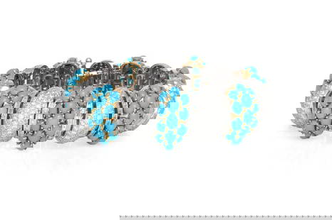 18k Turquoise Diamond Link Bracelet: Spectacular vintage 1980s turquoise and diamond bracelet, finely crafted in 18k white and yellow gold. - Cabochon turquoises, total approx. 41.75 carats - Round brilliant and baguette diamonds, total