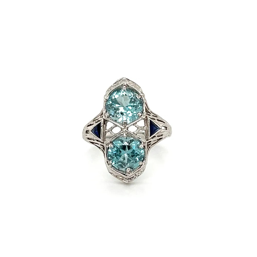 Art Deco 18k WG Blue Zircon Sapphire Ring: Art Deco navette ring in 18k white gold featuring approx. 5tcw of round blue zircon and synthetic sapphire stones, 4.0g, ring size 5.5. - Approx. 5 total carats of blue zircon & synthetic sapphire - T