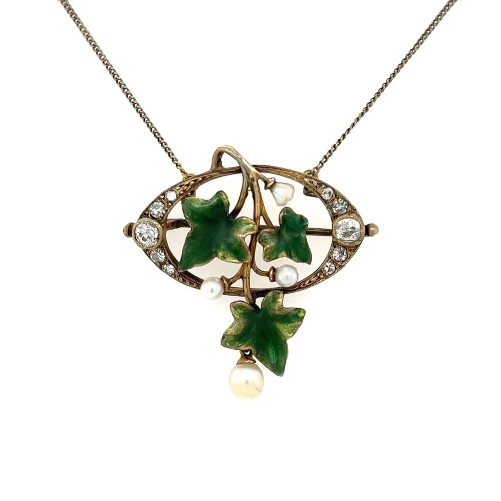 Antique Sterling Diamond Pearl Enamel Necklace: Antique necklace crafted in .925 sterling silver featuring approximately 0.70 total carats of diamonds, accented by a pearl and green enamel leaf motifs, measuring 18 inches. - Approx. 0.70tcw diamond
