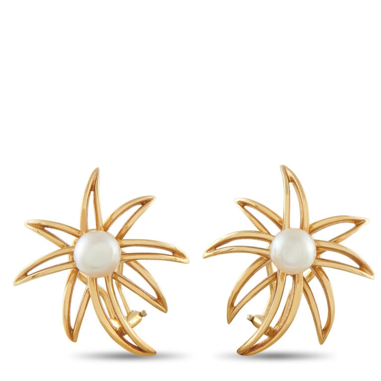 Tiffany 18k Gold Pearl Fireworks Earrings: Tiffany & Co. Fireworks clip-on earrings in 18k yellow gold, designed with radiant openwork and centered pearls for a timeless statement. - 18k yellow gold with pointed openwork radiating design - Cen