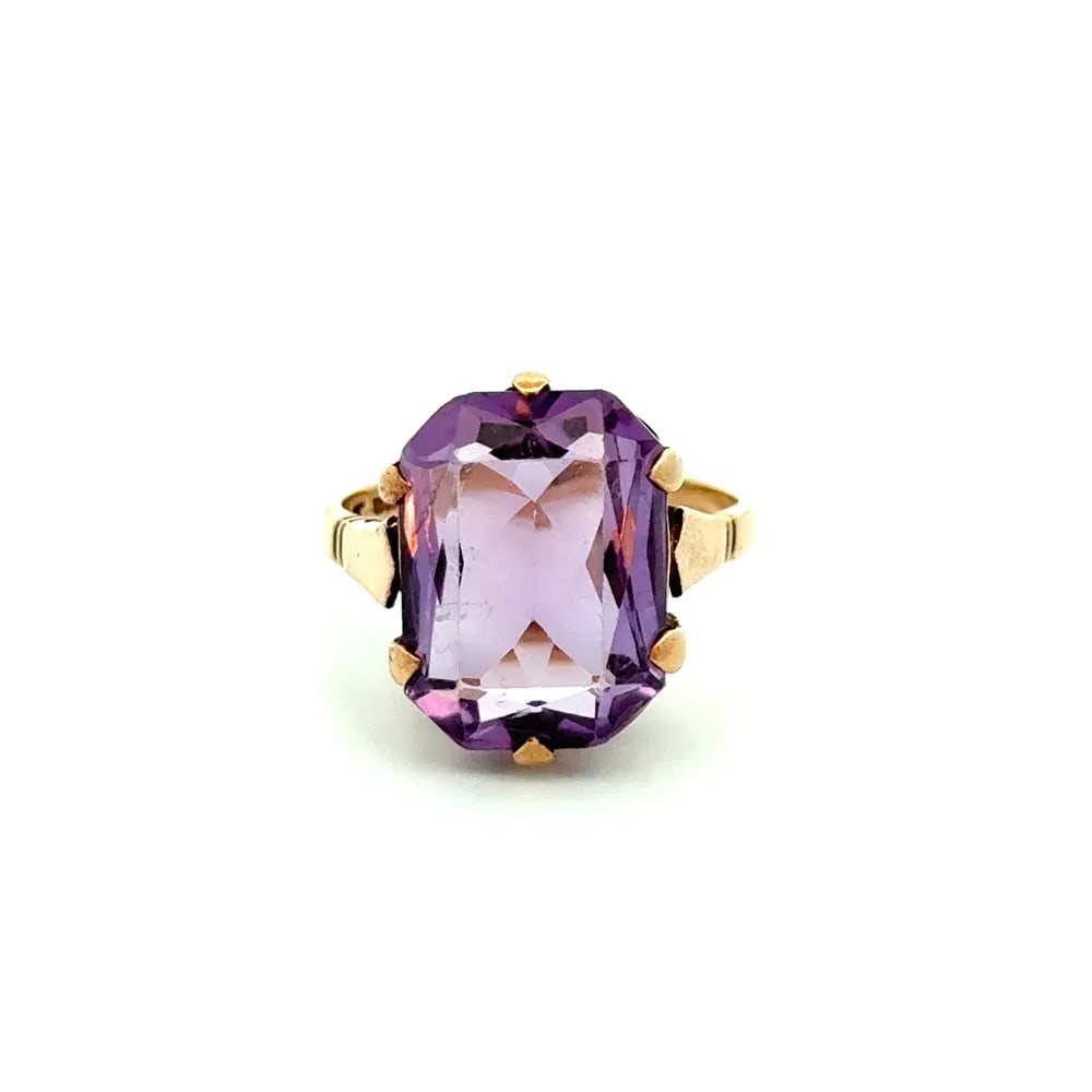 Victorian 9k Gold 5ct Amethyst Solitaire Ring: Victorian English solitaire ring in 9k yellow gold set with a richly hued 5.00ct emerald-cut amethyst, weighing 5.7 grams and offered in size 8.25. - Emerald-cut amethyst weighing approx. 5.00 carats