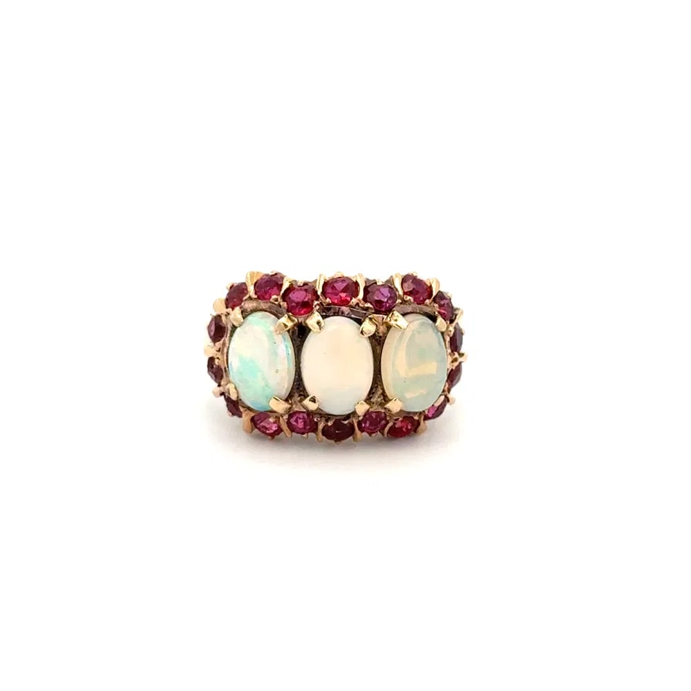 Victorian 14k Gold Opal Ruby Ring: Victorian-era 3-stone cluster ring in 14k yellow gold showcasing a total of 1.00ct opal and 1.00ct ruby in a classic antique design. - Features approx. 1.00tcw opal and 1.00tcw ruby - Crafted in 14k y