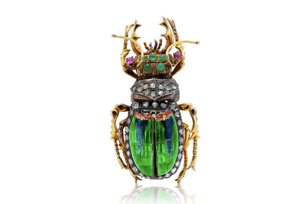 14k Enamel Gem Beetle Brooch: Whimsical beetle brooch crafted in 14k yellow gold, silver, and enamel with cabochon emeralds, rubies, and approx. 1.00ct rose-cut diamonds. - Crafted in 14k yellow gold and silver with detailed ename