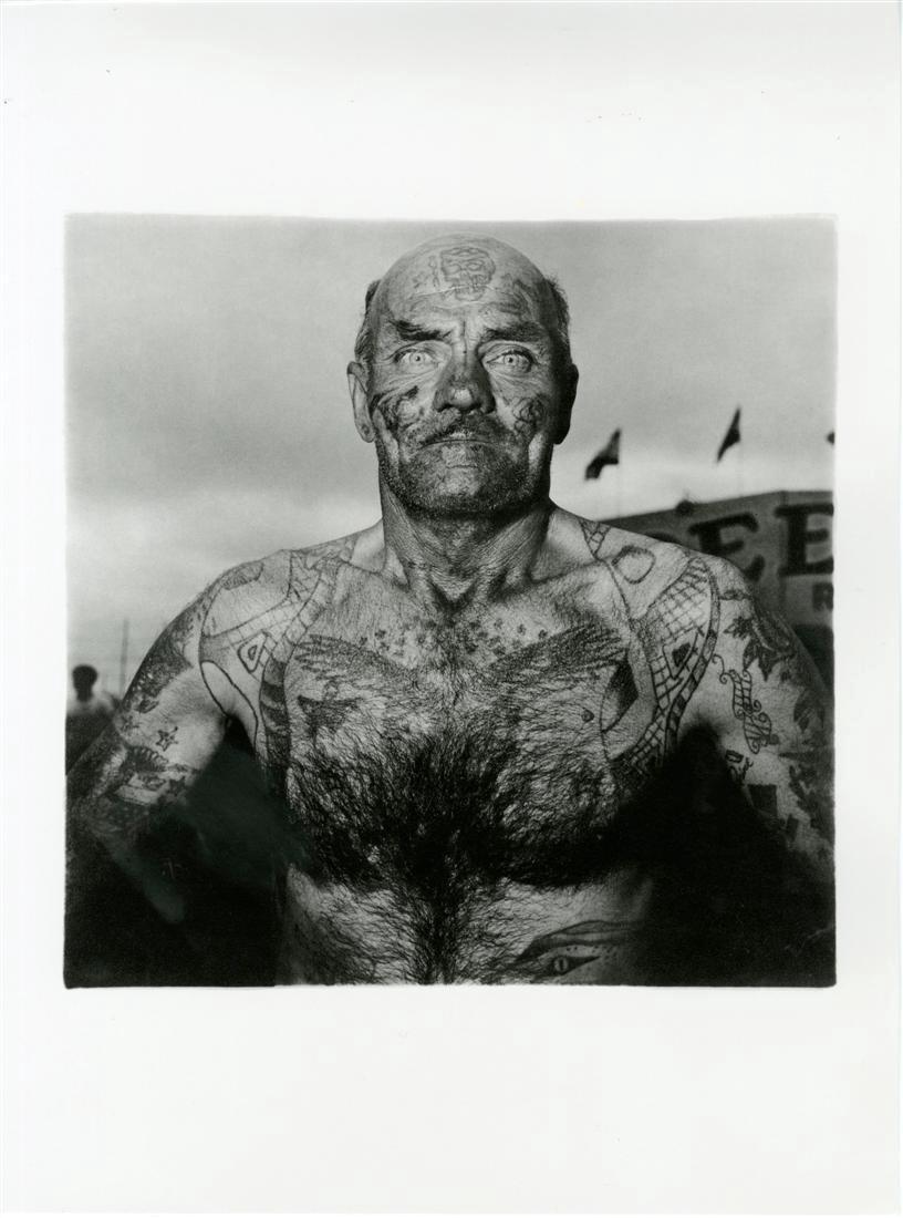 DIANE ARBUS - Tattooed Man at a Carnival, Maryland: Diane Arbus (American, 1923-1971). "Tattooed Man at a Carnival, Maryland". Original photogravure. 1970. Printed 1978. Stamped with photographer's name, verso. Edition of 1,000. High-grade archival pap