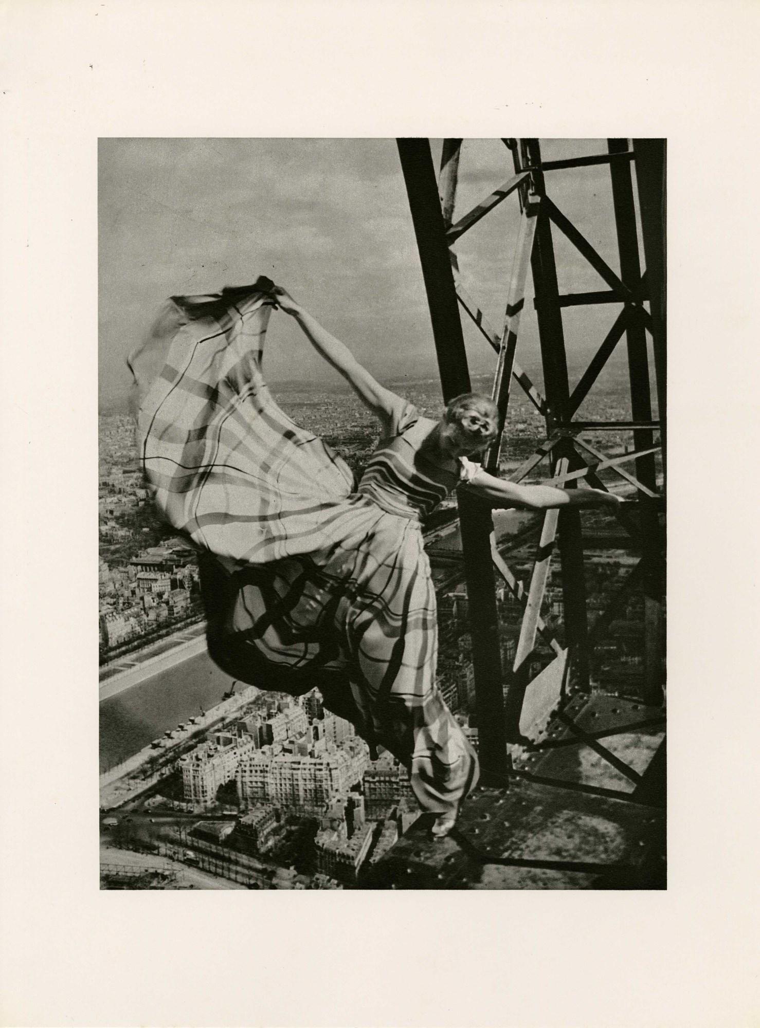 ERWIN BLUMENFELD - Lisa Fonssagrives on the Eiffel: Artist: Erwin Blumenfeld (German-American, 1897-1969). Title: "Lisa Fonssagrives on the Eiffel Tower [For Vogue - Dress by Lelong]". Medium: Original photogravure. Date: Composed 1939. Printed