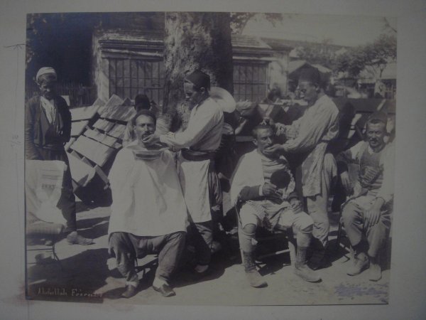 ABDULLAH FRERES (Armenian) Vintage albumen print: Abdullah Freres (Armenian, Active 1860s - 1890s). "Barbers". Vintage albumen print. c1880s. Printed c1880s. Credited and numbered (298) in the negative, lower left. 8 x 10 1/4 in. (203 x 260 mm). Affi