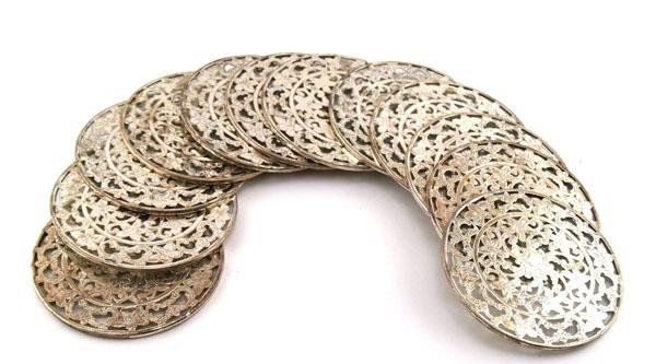 TILDEN-THURBER [JEWELERS] (American) Silver: Tilden-Thurber [jewelers] (American, 20th Century). "Set of 12 Sterling Silver Coasters". Silver. Manufactured by Tilden-Thurber Jewelers. Each with cloth bag. Includes original box. 3 in. diameter. [