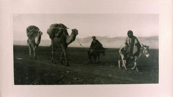 ABDULLAH FRERES (Armenian) Vintage carbon (?) prin: Abdullah Freres (Armenian, Active 1858-1900). "Bedouins and Camels in the Desert". Vintage carbon (?) print. c1890s. Printed c1890s. 10 1/4 x 20 1/4 in. (260 x 514 mm). Sheet Size: 13 1/2 x 24 in. (34