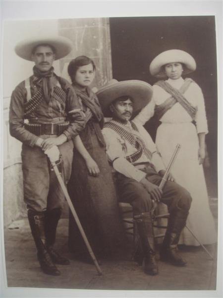 AUGUSTIN VICTOR CASASOLA (Mexican) Gelatin silver: Augustin Victor Casasola (Mexican, 1874 - 1938). "Dos Parejas Revolucionarios [Mexico]". Gelatin silver print. c1910. Printed later from the original negative. Casasola Studios embossed blindstamp sea