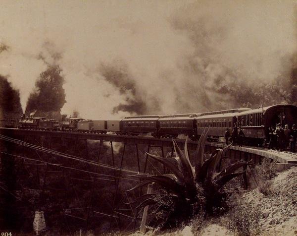 OTIS M. GOVE (American) Vintage albumen print: Otis M. Gove (American, 1851 - 1931). "Grafton's Special Train Crossing the Great Bridge near Dos Rios, Mexican National Railroad [Mexico]". Vintage albumen print. c1880. Printed 1880. Numbered 204 in