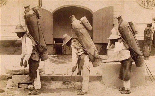OTIS M. GOVE (American) Vintage albumen print: Otis M. Gove (American, 1851 - 1931). "Native Water Carriers at Guanajuato [Mexico]". Vintage albumen print. c1880. Printed 1880. Numbered 27 in negative. 4 1/16 x 7 1/16 in. (103 x 179 mm). [22953]