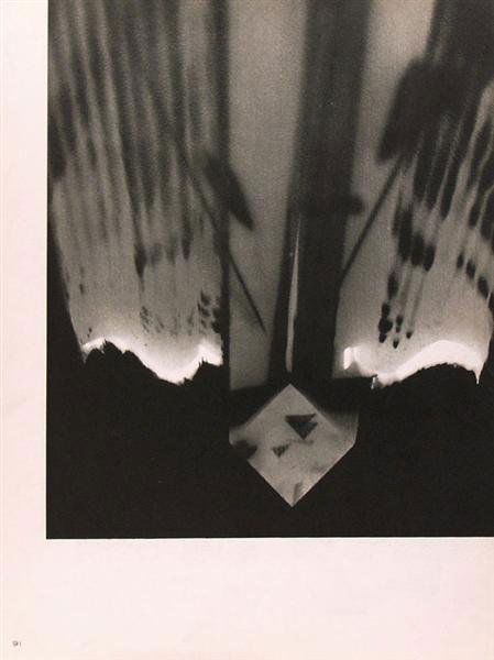 MAN RAY (American) Original vintage gravure: Man Ray (American, 1890 - 1976). "Rayograph [#012]". Original vintage gravure. c1920-1934. Printed 1934. 9 15/16 x 8 1/4 in. (252 x 210 mm). Sheet Size: 12 3/16 x 9 3/16 in. (310 x 233 mm). From Man R