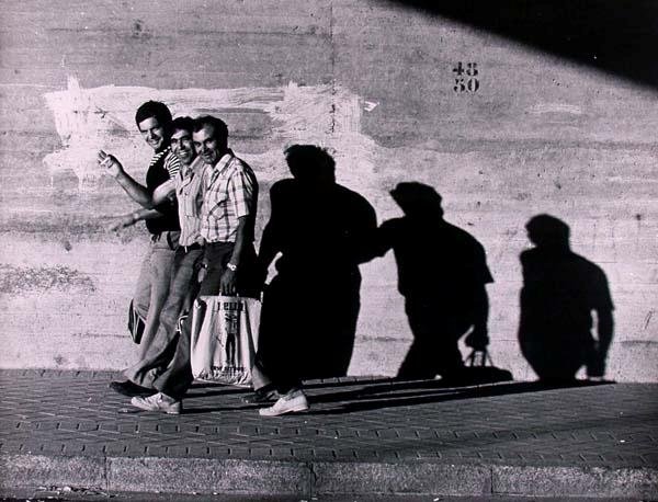 MARTIN H. MILLER (American) Vintage gelatin silve: Martin H. Miller (American, 1917 - 2005). "Three Men Casting Shadows". Vintage gelatin silver print. c1960s. Printed c1960s. Photographer's stamp, verso. 15 9/16 x 20 1/16 in. (395 x 510 mm). Sheet Si
