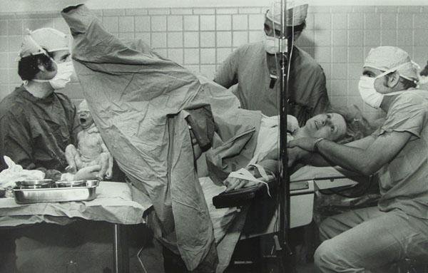 MORRIS BERMAN (American) Gelatin silver print: Morris Berman (American, 1910 - 2002). "Helping Hands". Gelatin silver print. 1973. Printed 1973. Stamp signed, dated, annotated and estate stamped, verso. 8 5/8 x 13 3/8 in. (219 x 340 mm). Provenanc